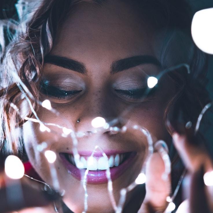 Ava Singh, Lead Design Curator at Silver Line Matrix, reviewing corporate floral arrangements